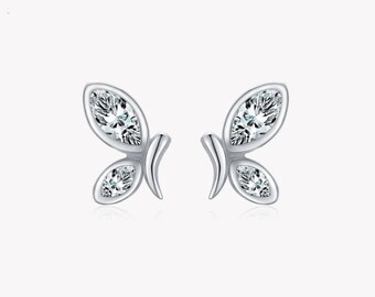 May include: A pair of silver butterfly earrings with clear cubic zirconia stones.