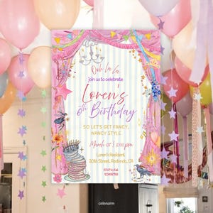 May include: A rectangular birthday invitation card featuring a pink curtain border, a chandelier, and a stack of plates. The text reads: Ooh la la, join us to celebrate Loren's 6th Birthday, SO LET'S GET FANCY, NANCY STYLE, March 07, 5:00 pm, 20th Street, Redondo, CA.