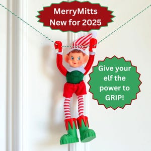 May include: A toy elf hanging from a green and white string, wearing a red and white striped hat, red sleeves, green vest, red shorts, red and white striped leggings, and green boots. Text reads: MerryMitts New for 2025 and Give your elf the power to GRIP!