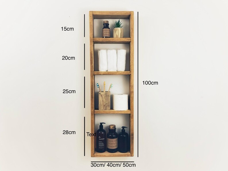 May include: A wooden shelf unit with four shelves, measuring 100cm tall, 30cm wide, and 40cm deep. The shelves are filled with various items, including towels, toiletries, and plants. The shelf unit is a great way to organize and display items in a bathroom or other room.