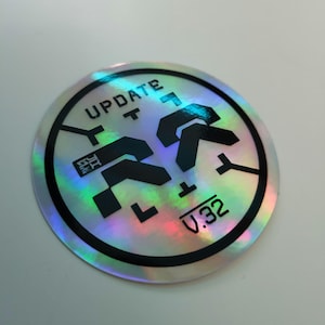 HOLOGRAPHIC UPDATE STICKER - Cyberpunk Techwear Sticker Premium Vinyl Sci-fi - Sleek Modern Design for Notepads, Bottles, Laptops, Tech,