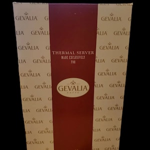 May include: A brown and white box with the text "GEVALIA" and "THERMAL SERVER MADE EXCLUSIVELY FOR" printed on it. The box has a red stripe down the center with the GEVALIA logo.