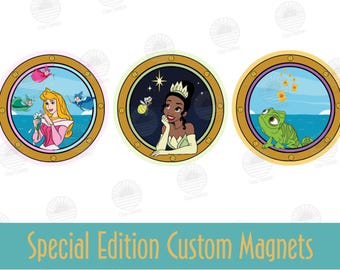 May include: Three round magnets featuring Disney princesses. The first magnet features a pink-clad princess with blonde hair, the second features a green-clad princess with dark skin and a crown, and the third features a green chameleon.