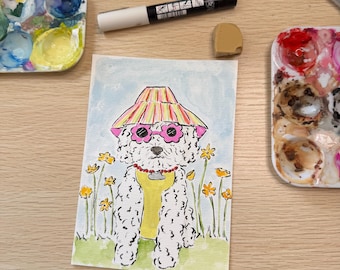 May include: A watercolor painting of a white curly-haired dog wearing a striped bucket hat, pink flower-shaped sunglasses, and a yellow shirt. The dog is surrounded by yellow flowers on a light green background, with paint palettes and art supplies.