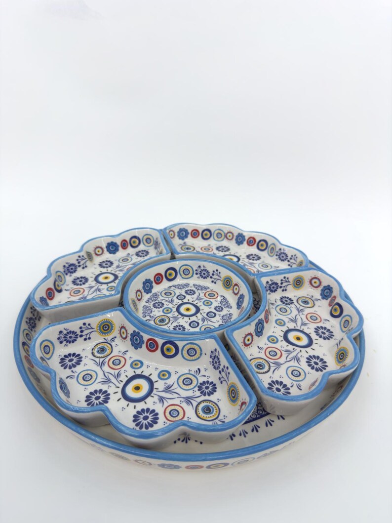 Handmade Turkish breakfast set with six blue floral ceramic bowls and a matching tray. Ottoman-inspired patterns, crafted from high-quality, food-safe ceramic. Perfect for serving breakfast, appetizers, or dips, adding elegance to any table setting.