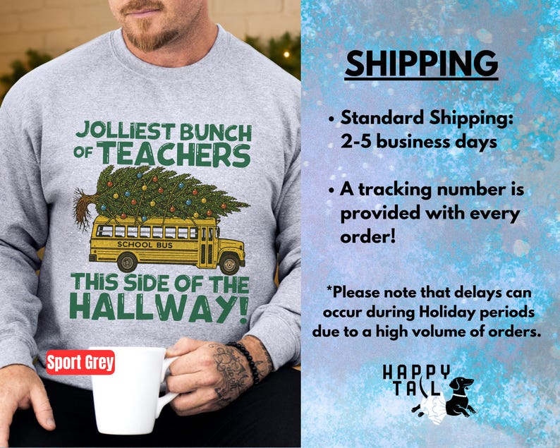 May include: A sport grey crewneck sweatshirt featuring a graphic of a yellow school bus carrying a decorated Christmas tree on its roof. The text reads JOLLIEST BUNCH OF TEACHERS THIS SIDE OF THE HALLWAY in green and black lettering.