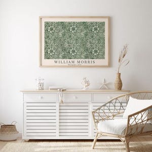May include: A framed print of a green and white floral pattern with the text "WILLIAM MORRIS Marigold | 1875" at the bottom.