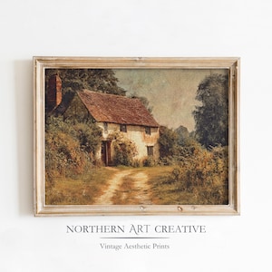 May include: Framed vintage print of a cottage with a red tile roof, surrounded by lush greenery and a dirt path leading to the front door. The artwork is in a distressed wooden frame. The text "NORTHERN ART CREATIVE" and "Vintage Aesthetic Prints" are at the bottom.