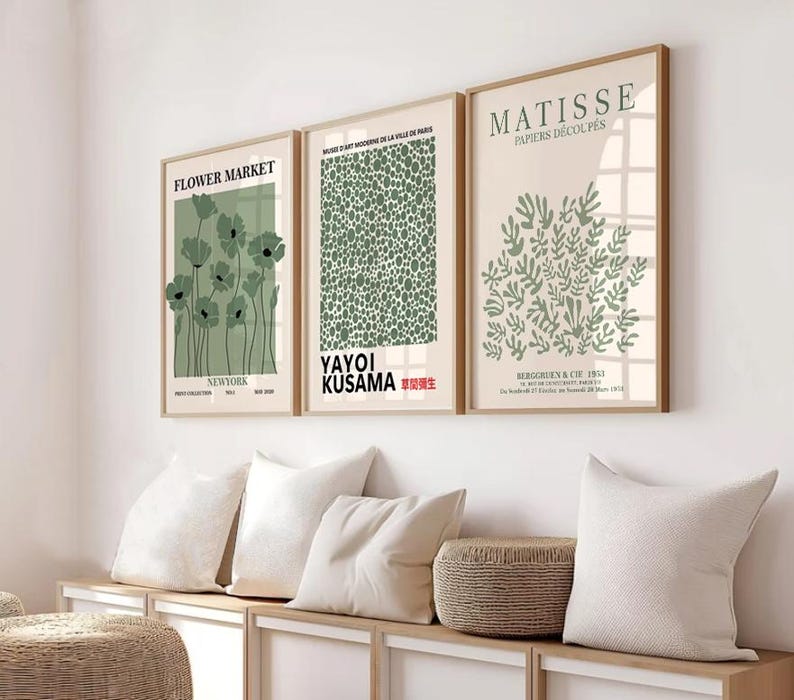 May include: Three framed art prints with a minimalist design. The prints feature green and white illustrations of flowers, abstract shapes, and leaves. The prints are titled "Flower Market", "Yayoi Kusama", and "Matisse, Papiers Decoupes".