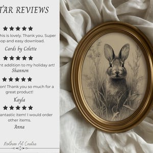 May include: An oval framed print featuring a detailed pencil sketch of a rabbit in tall grass. The frame is gold-colored. The image is set against a white fabric background. Text on the left side reads "5 STAR REVIEWS" and customer testimonials.