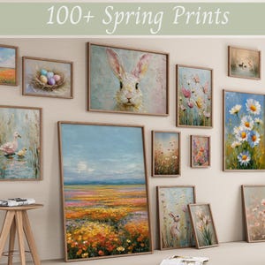 May include: A selection of framed spring art prints. The artwork features paintings of a rabbit, flowers, landscapes, and ducks. The prints vary in size and style, with a neutral colour palette and wooden frames. The text "100+ Spring Prints" is at the top.