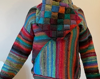 May include: A colorful striped sweater with a large, multi-colored knit cowl neck.