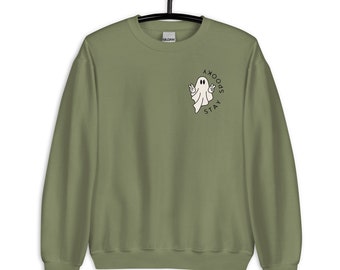 May include: A green sweatshirt with a white ghost graphic and the text "Stay Spooky" printed on the front.