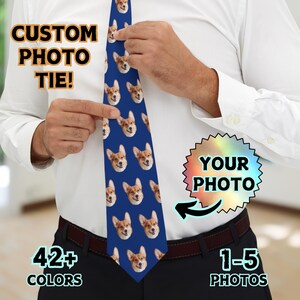 May include: A blue tie with a repeating pattern of a dog's face. The text "CUSTOM PHOTO TIE!" is in the top left corner. The text "YOUR PHOTO" is in a rainbow-colored starburst shape in the top right corner. The text "42+ COLORS" is in the bottom left corner. The text "1-5 PHOTOS" is in the bottom right corner.