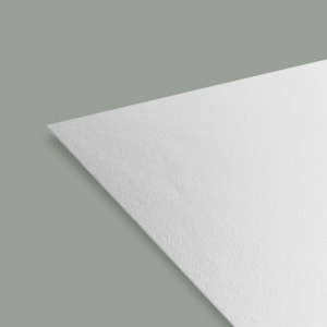 a close-up view of a white, flat surface, possibly a piece of paper or a white-colored object.