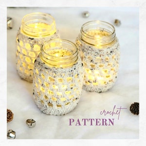 Crochet Pattern for mason jar covers. Covers shown on a set of 3 mason jar glasses with votive candles illuminating through the crochet netting.