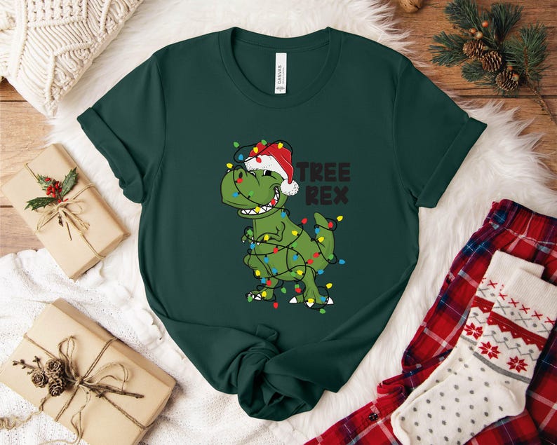 a t - shirt with a dinosaur wearing a christmas hat