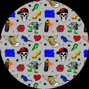 May include: A circular pattern featuring a repeating design of skulls wearing red caps, winged sneakers, skateboards, boomboxes, roses, lightning bolts, hearts, and the text "COOL DUDE" on a gray background. The design has a street art or graffiti theme.