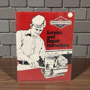 May include: A red manual with the text "Service and Repair Instructions" and the Briggs & Stratton logo. The cover shows a black and white illustration of a person working on an engine. The manual is for service parts.