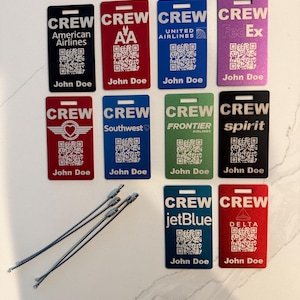 May include: Ten colorful plastic airline crew ID badges with a QR code and the name John Doe. The badges are for American Airlines, AA, United Airlines, FedEx, Southwest, Frontier Airlines, Spirit, JetBlue, and Delta.