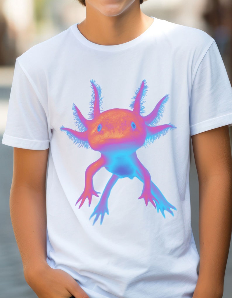 May include: White t-shirt with a colorful axolotl graphic. The axolotl is a pink and blue amphibian with feathery gills.