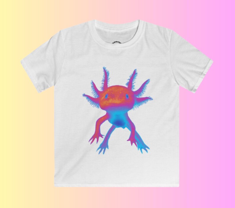 May include: White t-shirt with a colorful axolotl graphic. The axolotl is a pink, blue, and orange amphibian with feathery gills.