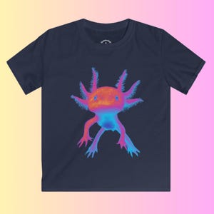 May include: A navy blue t-shirt with a neon pink and blue axolotl graphic. The axolotl is a type of salamander with feathery gills.