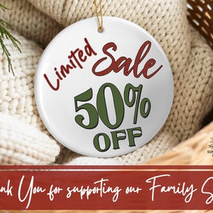May include: A round white ceramic ornament featuring the red text Limited and the red text Sale, with the green text 50% and the green text OFF. A small logo with the text SUNNY SKETCH DESIGNS is visible. A gold string is attached to the top.