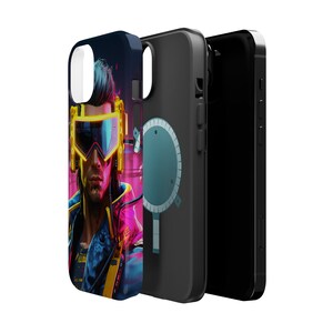 May include: A black phone case with a colorful image of a person wearing futuristic goggles and a jacket. The case has a black and blue circular design on the back.