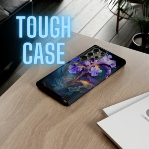 May include: A black phone case with a vibrant floral design featuring a purple iris. The case has a glossy finish and the words "TOUGH CASE" in a glowing blue font. The case is on a light wood surface.