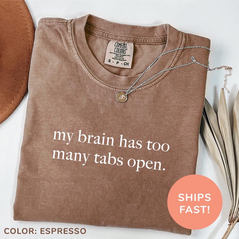 a t - shirt that says, my brain has too many tabs open