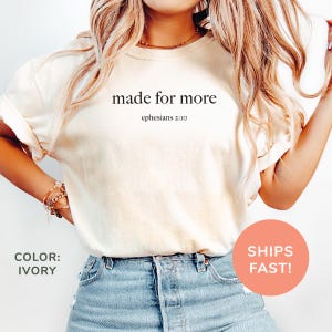 a woman wearing a t - shirt that says made for more