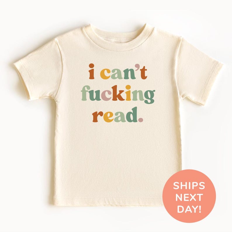 a t - shirt with the words i can't fucking read printed on it