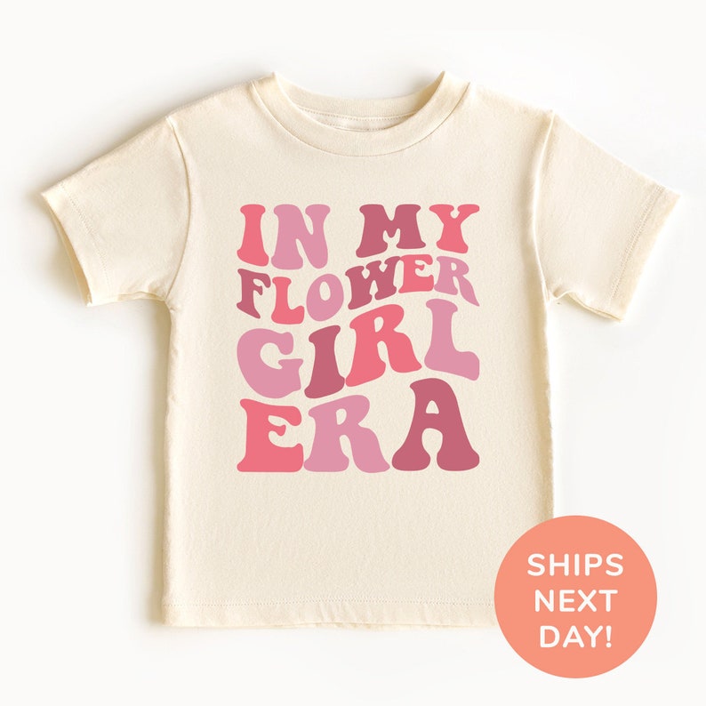 a little girl wearing sunglasses and a t - shirt