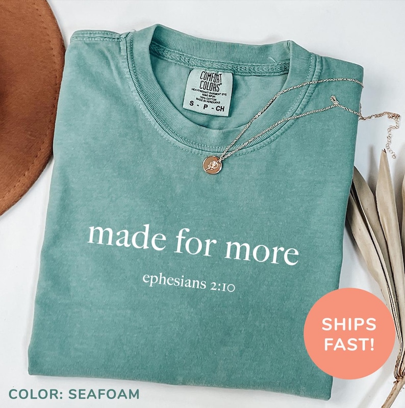 a t - shirt that says made for more on it