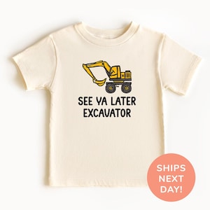 May include: Cream-colored short-sleeved t-shirt featuring a yellow excavator graphic and the text "SEE YA LATER EXCAVATOR" in black. The excavator design includes black wheels and a yellow arm.