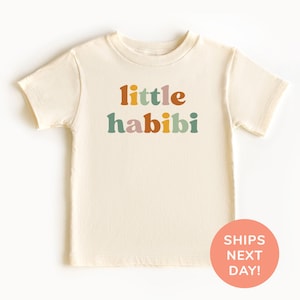 a t - shirt with the words little habibi printed on it