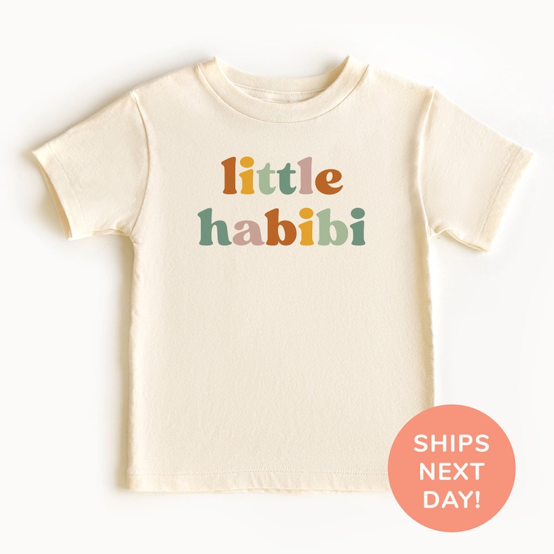 a t - shirt with the words little habibi printed on it
