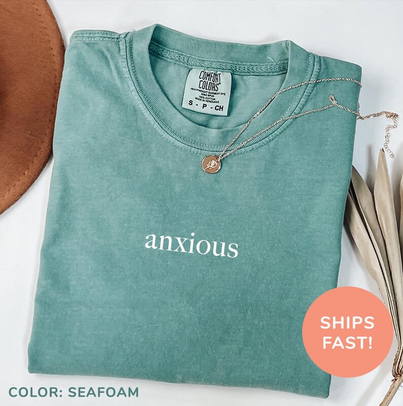 a t - shirt with the words anxious on it