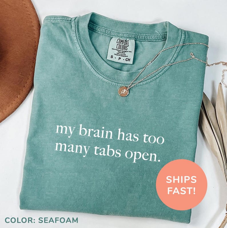 a t - shirt that says, my brain has too many tabs open