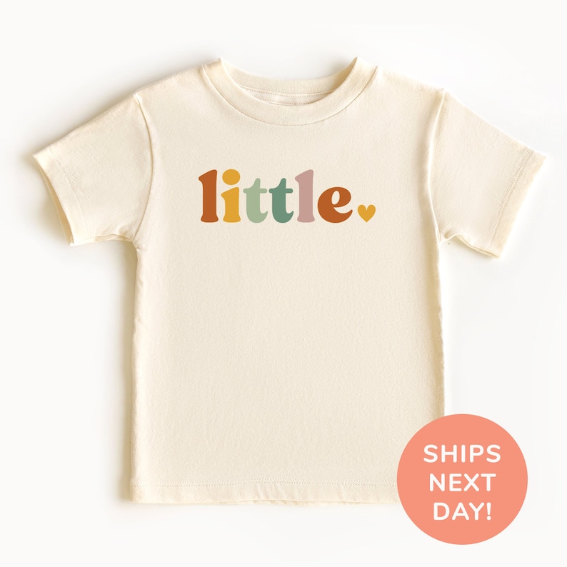 a white shirt with the words little on it