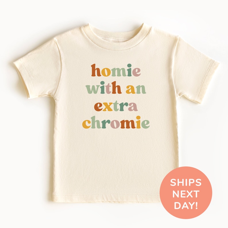 a t - shirt with the words home with an extra chrome on it