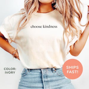 a woman wearing a t - shirt that says choose kindness