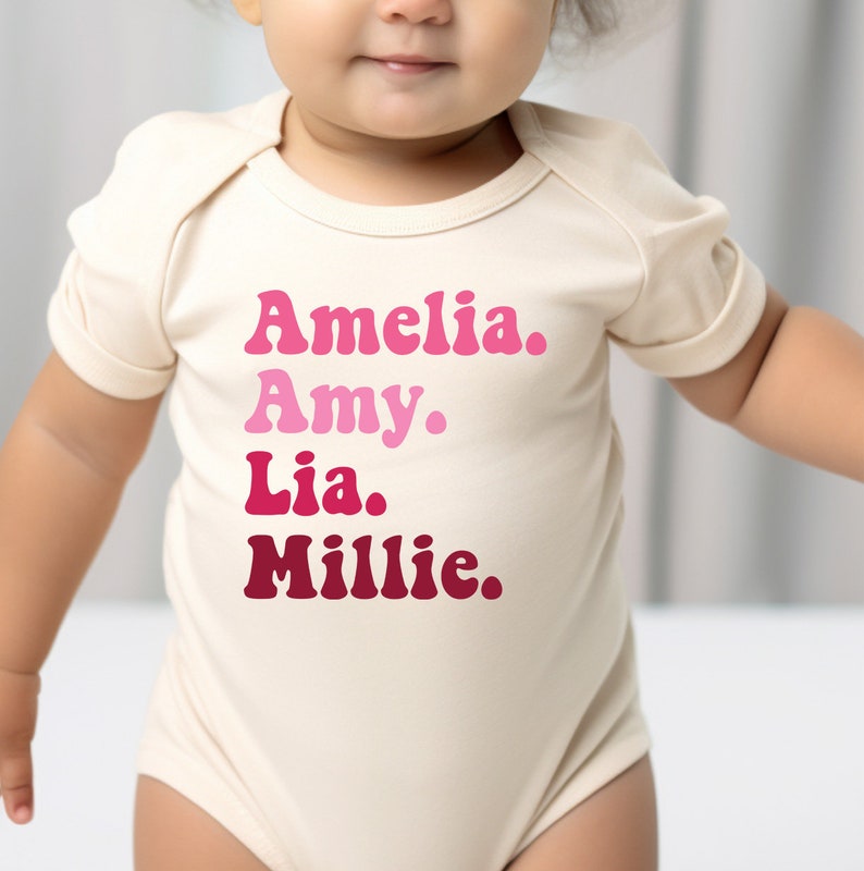 a baby girl wearing a bodysuit that says, amella, amy,