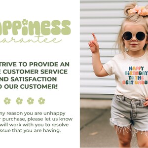 a little girl wearing a happy birthday t - shirt