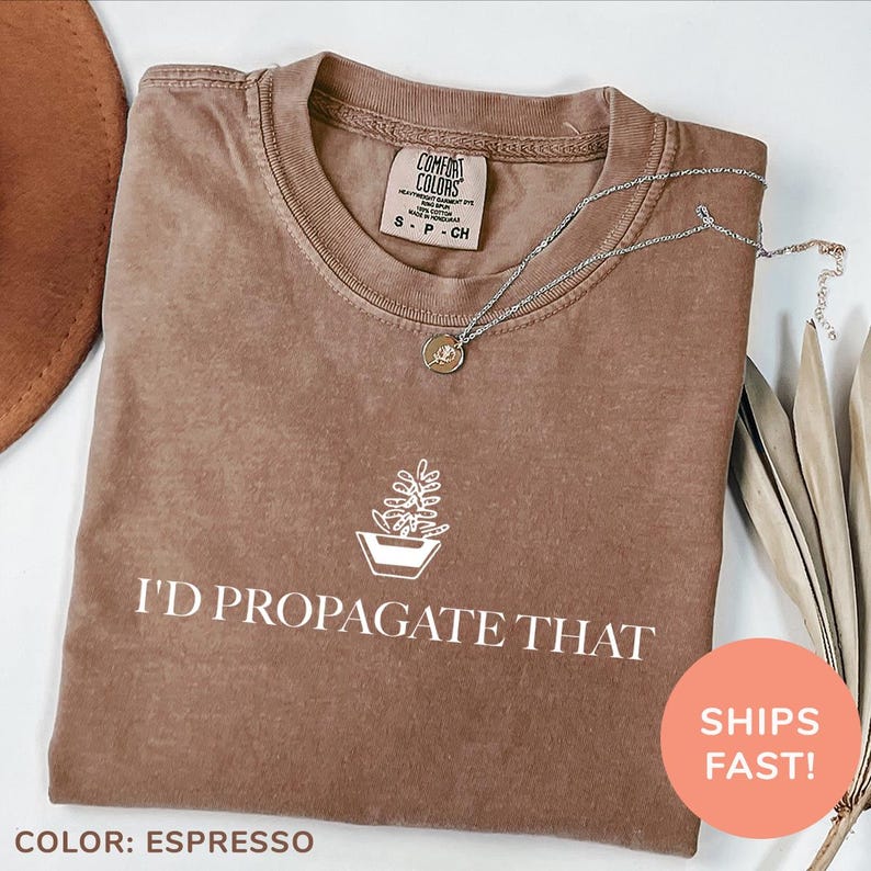 a brown t - shirt that says i'd propagate that with a