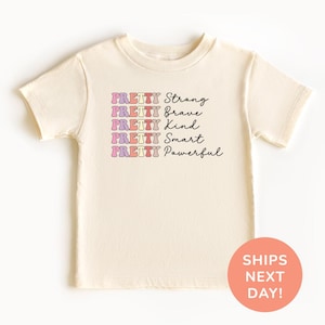 a t - shirt with the words, strong, brave and smart, printed on