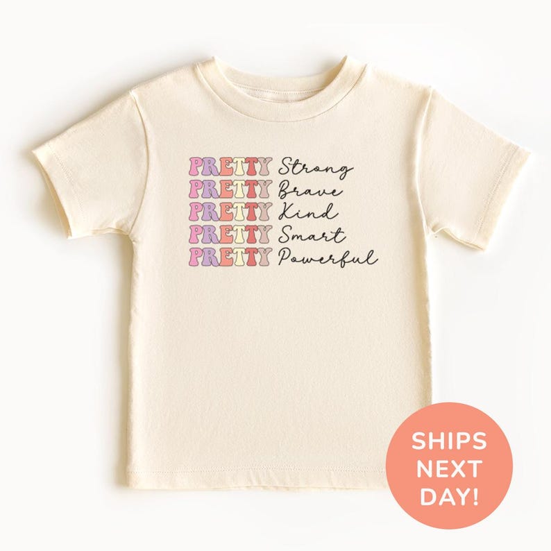 a t - shirt with the words, strong, brave and smart, printed on