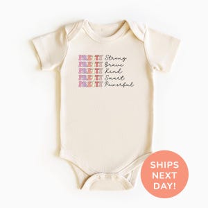 a baby bodysuit with a message on it
