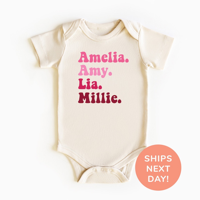 a white bodysuit with pink and red letters on it